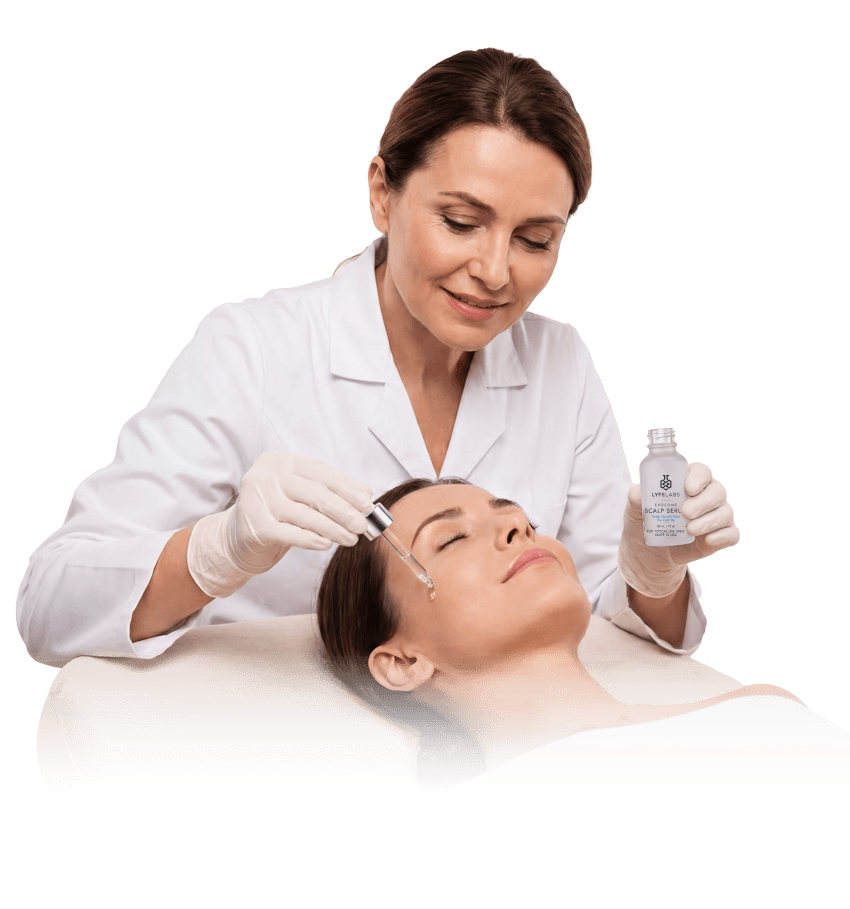 Clinician applying Lyfe Labs Exosome Scalp Serum with a dropper